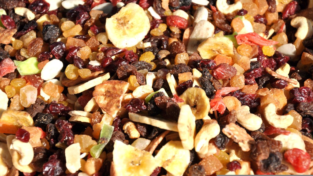 Close-up of a colorful mixture of dried fruits, nuts, and banana chips